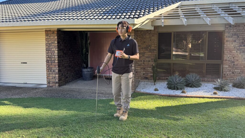 Max Leak Detection technician using acoustic leak detection equipment, servicing Jindalee