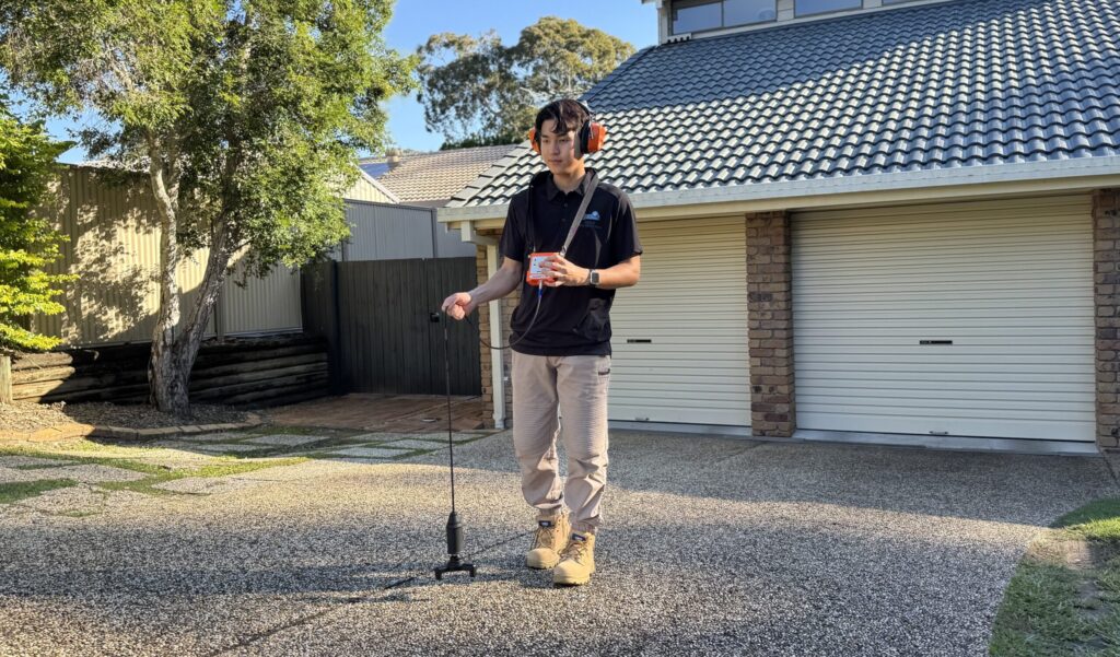 Max Leak Detection technician using acoustic leak detection equipment, servicing Rocklea